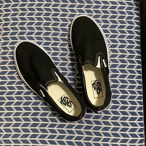 Solid black vans slip ons
